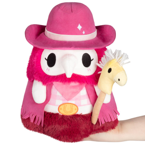 Cowboy-themed Plague Nurse. She is pink, wearing a pink hat and jacket, and holding a yellow stick horse.