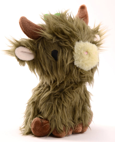 A plush toy resembling a mossy green highland cow with white and brown accents