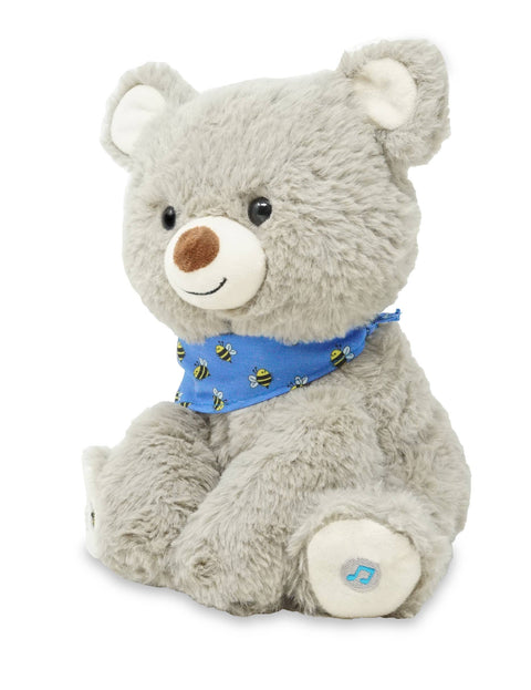 Plush grey teddy bear with a blue bandana on a white background
