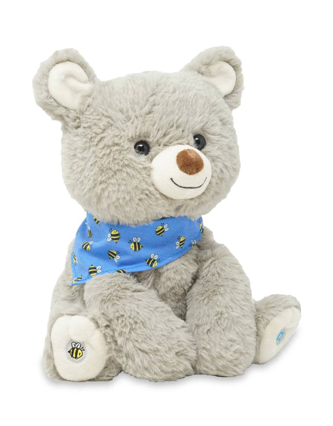 Plush teddy bear with a blue bandana featuring bee patterns on a white background