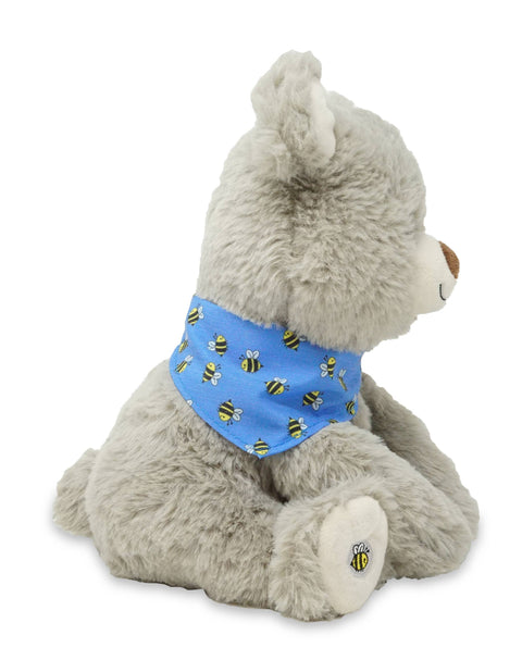 Plush bear wearing a blue bandana with bee patterns on a white background