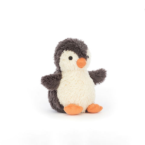 Stuffed penguin toy on a white background