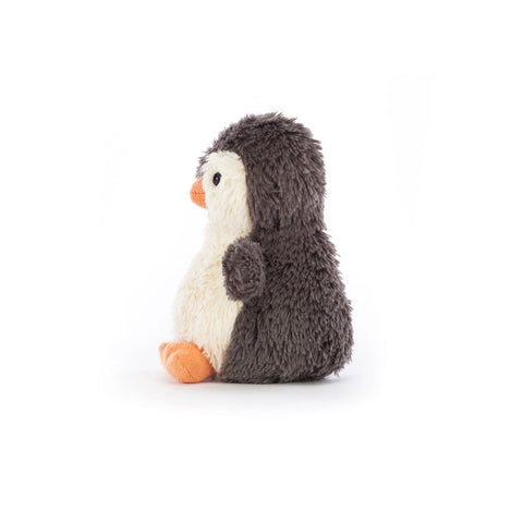 Side view of a Plush penguin toy on a white background