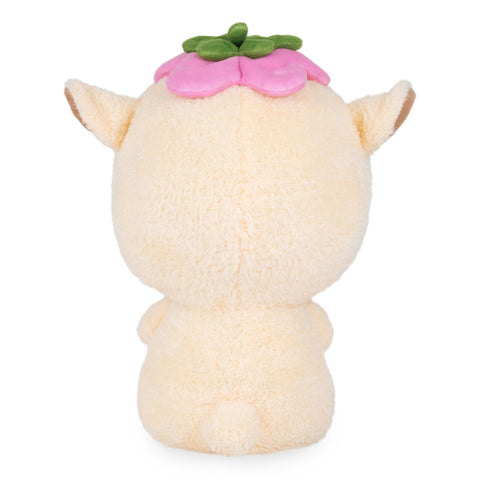 Back view of a plush capybara with a pink flower on its head