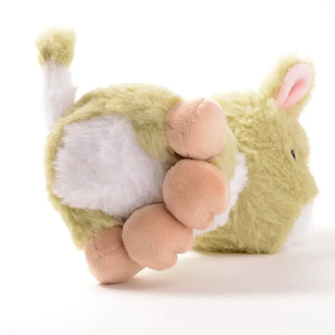 Bottom view of the sprout cow. Its belly is white, and its feet are tan