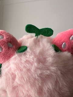 Close up of the strawberries and stem on top of the cow's head