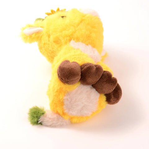 Bottom view of the stuffed sunflower cow. It has a white belly and a white and green tail