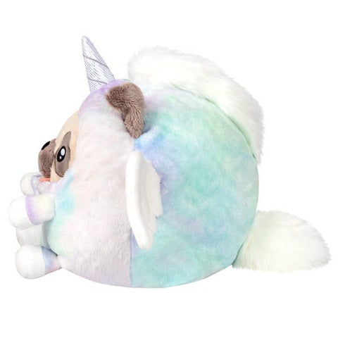 A side view of the plush pug wearing a unicorn costume