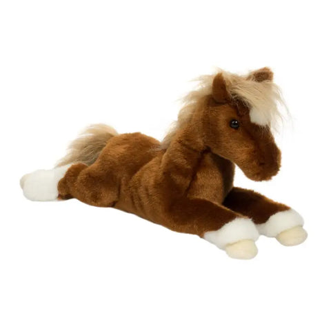 Image shows a side angle view of the stuffed horse. It is laying down.