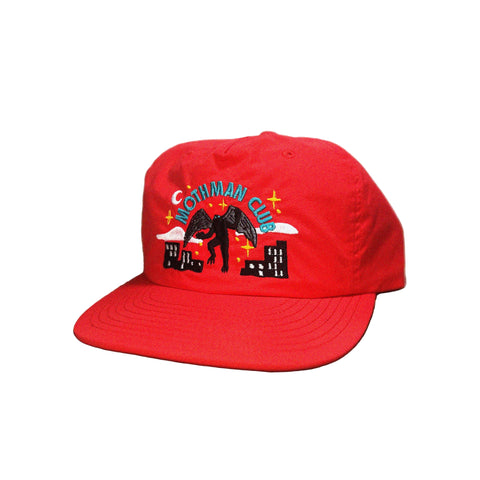 Red cap with a "Mothman club" embroidered design on a white background