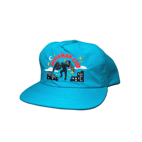 Blue cap with "Mothman Club" embroidered design on a white background