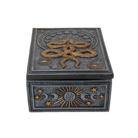 Image shows a front view of the tarot card box. The front has a crescent moons and stars.