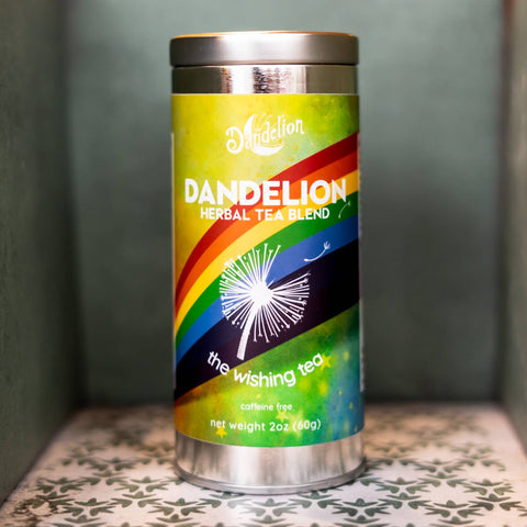 Dandelion herbal tea blend canister with colorful label on a patterned surface.