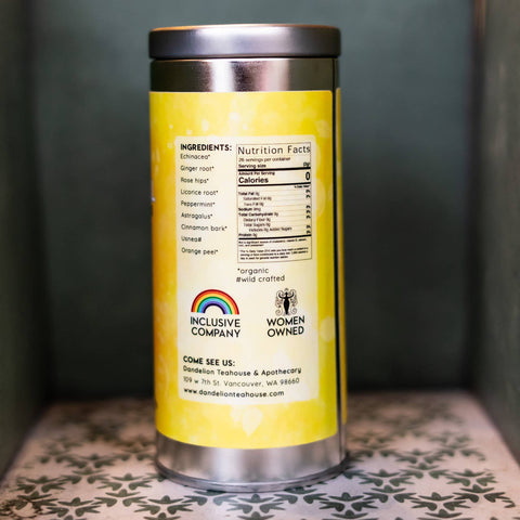 Silver tea canister with a yellow label. Label lists ingredients and nutrition facts.