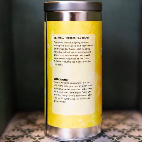 Yellow tea canister with text on a dark background. Text describes tea and gives directions.