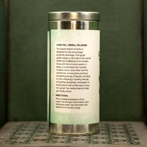 Herbal tea blend canister with text on a green background. Text describes tea and gives directions.