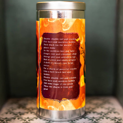 Tea canister with a decorative label featuring text on a dark background