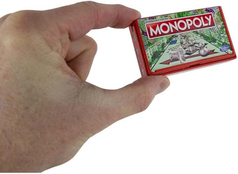 Image shows the monopoly box pinched between two fingers