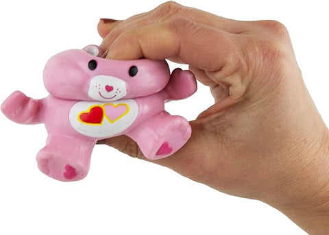 Image shows the Care Bear being squished