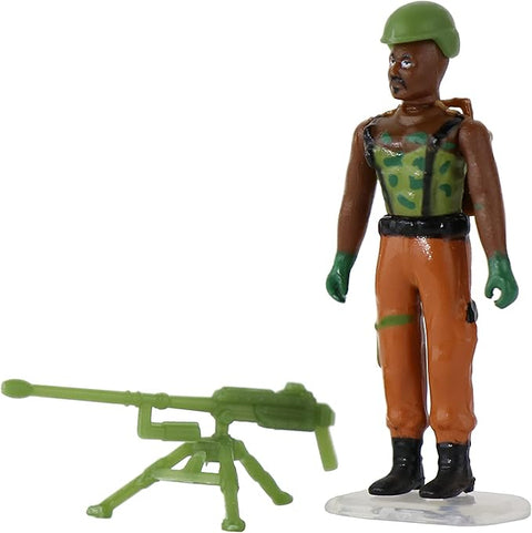 Image shows one of the world's smallest figurines. He wears army clothes and has a large gun on the ground.