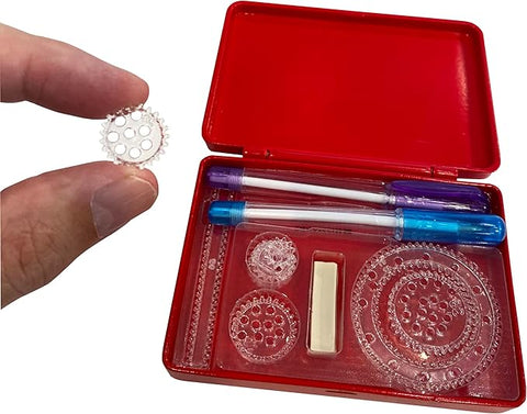 Image shows one of the small spirograph wheels pinched tightly between an adult's fingers