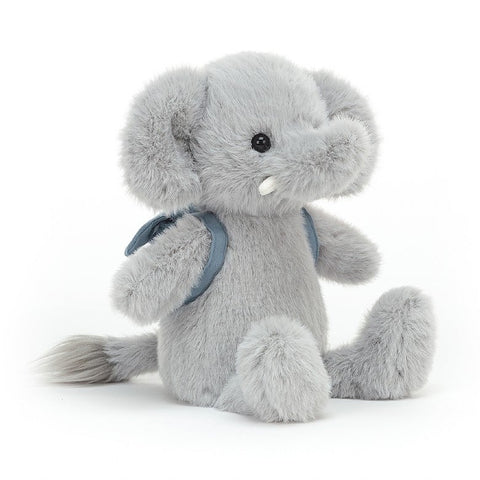 A blue stuffed elephant wearing a backpack