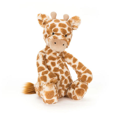 A seated stuffed giraffe