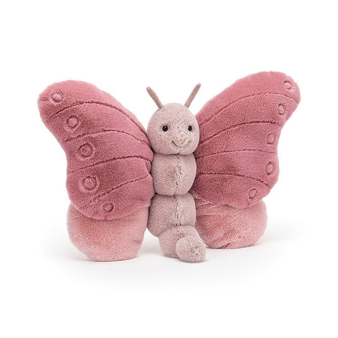 A stuffed butterfly with a pale pink body and darker pink wings