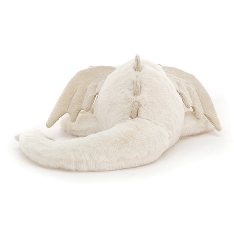 A back view of the white stuffed dragon