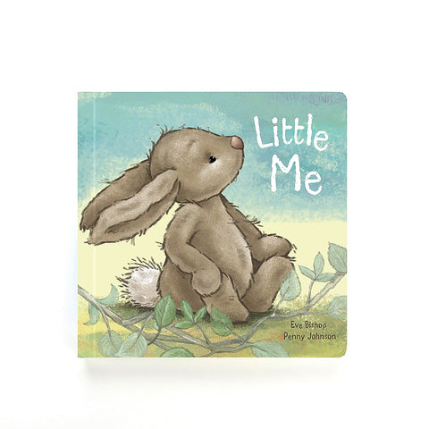 Board book featuring illustrated young bunny sitting on grass 