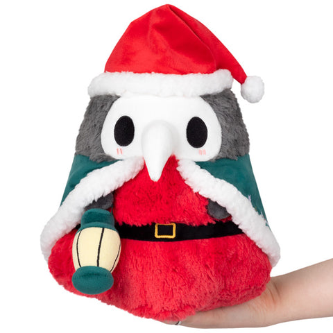 A plush toy resembling a Festive Plague Doctor with a red Santa hat, white lantern, black and gray feathered pattern, and a red coat.