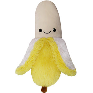 A plush toy designed to look like a banana with a smiling face and yellow body, resembling a real banana.