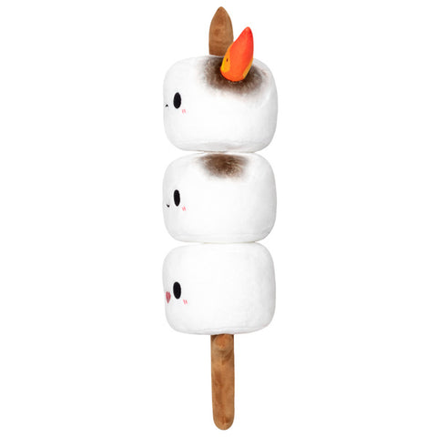 A side view of the plush marshmallow stick. The top marshmallow is on fire.