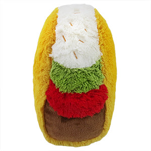 A side view of the plush taco, with brown, red, green, and white layers.