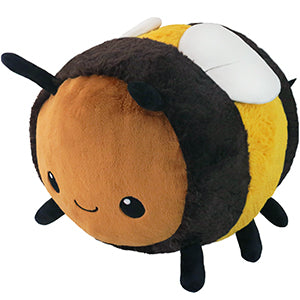 A plush toy resembling a bumblebee with a smiling face, in shades of yellow, black, and white.