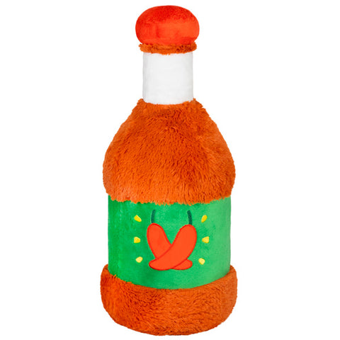 A back view of the plush hot sauce toy. The green label has two peppers.