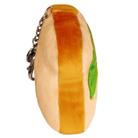 A side view of the plush avocado toast keychain