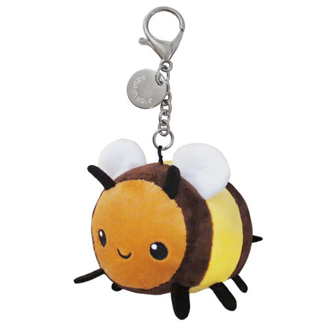 A plush bumblebee attached to a silver clip keychain
