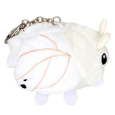 A side view of the stuffed poodle moth keychain