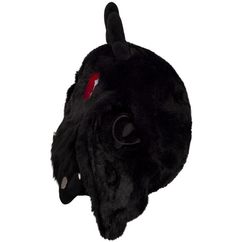 A side view of the plush baby Mothman
