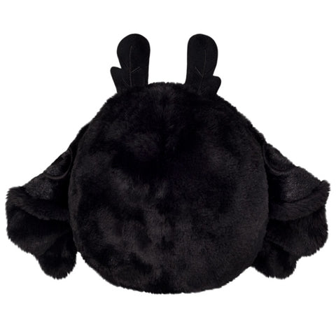 A back view of the plush baby Mothman with his wings down