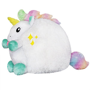 A side view of the plush unicorn. Its body is very round.