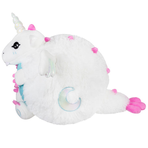 A side view of the plush dragon. It has a moon embroidered on its side.