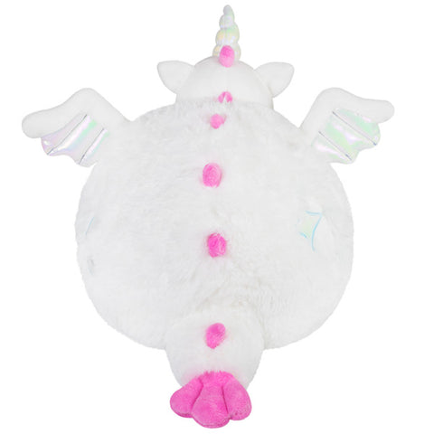 A back view of the plush dragon. Its spikes and tail are pink.