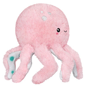 A side view of the plush pink octopus