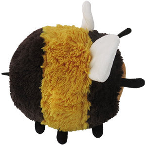 Side view of a plush bumblebee toy on a white background