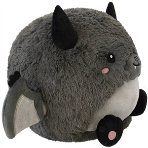 A side view of the plush bat. Its body is very round.