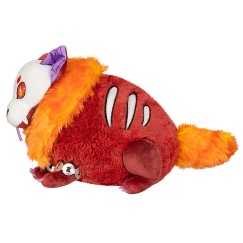 A side view of the plush hellhound. It has a rib-like design and a fluffy orange tail