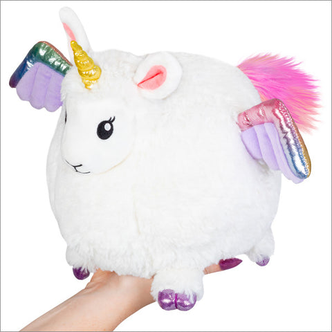 A round-bondied llamacorn held by a hand on a white background.