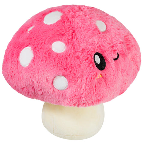 A side view of the pink plush mushroom